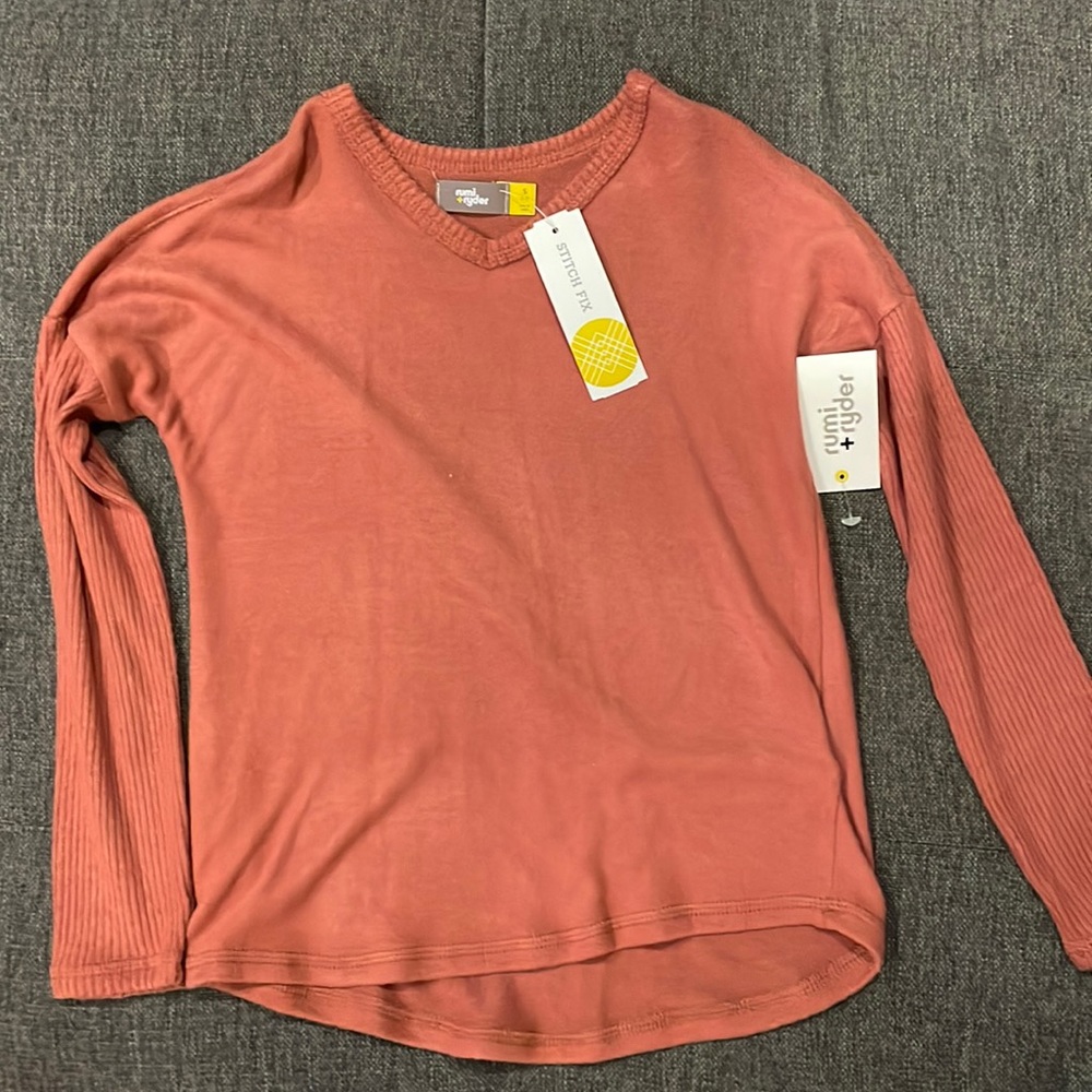 Rust colored sweater with detailed sleeves